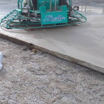 Close up view of machinery smoothing out concrete Cookstown
