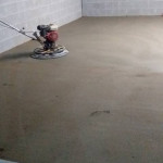 Smoothing out recently poured concrete floor